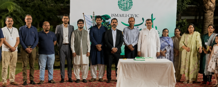 Tahir Javed participates in a Pakistan Independence Day celebration with community members and children.